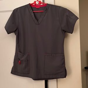 Gray with pink accents scrub top.  Size medium.